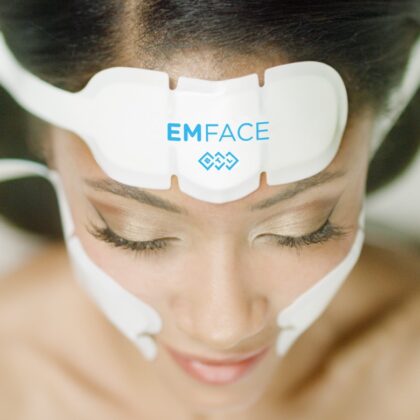 Overhead view of woman's face with EmFace nodes on her forehead and both cheeks.